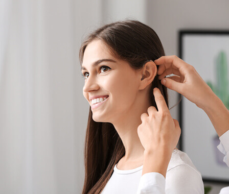 Woman having ear exam
