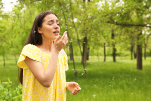 woman sneezing 