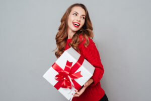 woman holding christmas present 